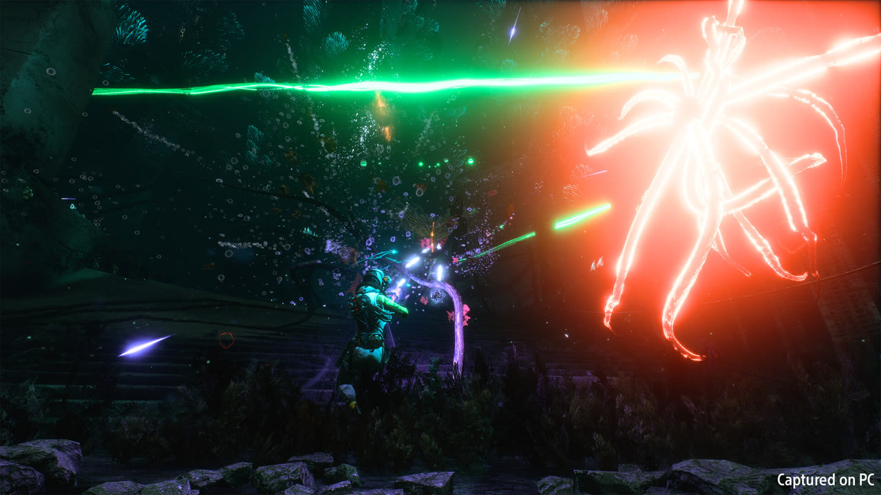 Returnal gameplay: Selene firing through a storm of green and orange bullet-hell projectiles in a dark alien jungle